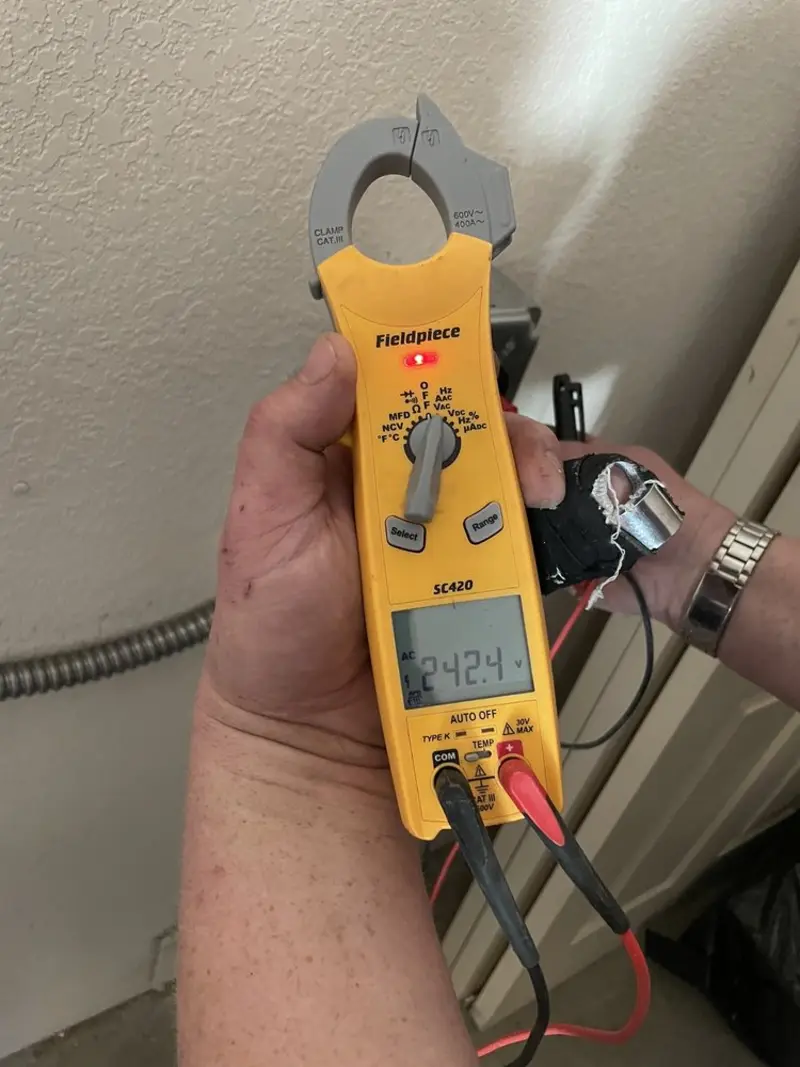 Voltage testing with clamp meter during Ceiling Fan Installation in Hahnville